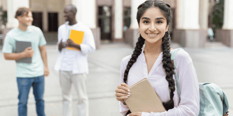 female student holding paper