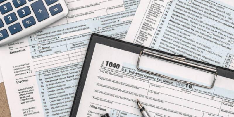 photo of tax documents 1040 on clipboard